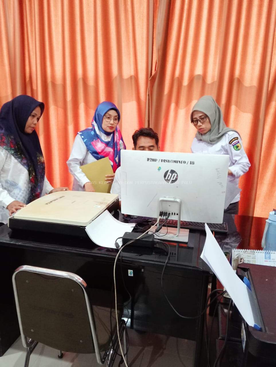 DINAS KEARSIPAN DAN PERPUSTAKAAN KOTA PALU LAKSANAKAN DIGITALISASI ARSIP STATIS